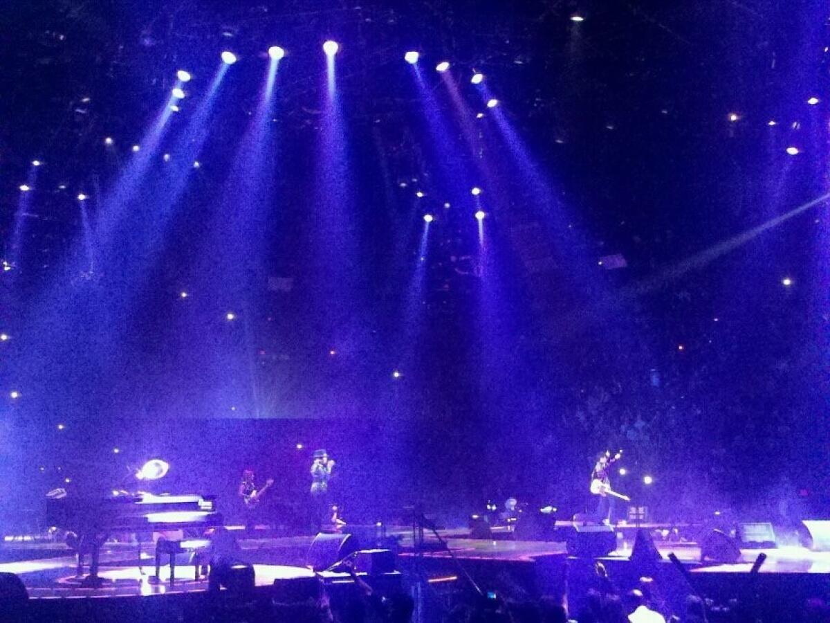 Plus, my own purple tribute to the artist — taken during a 2011 show at the Forum, as he performed "Purple Rain."