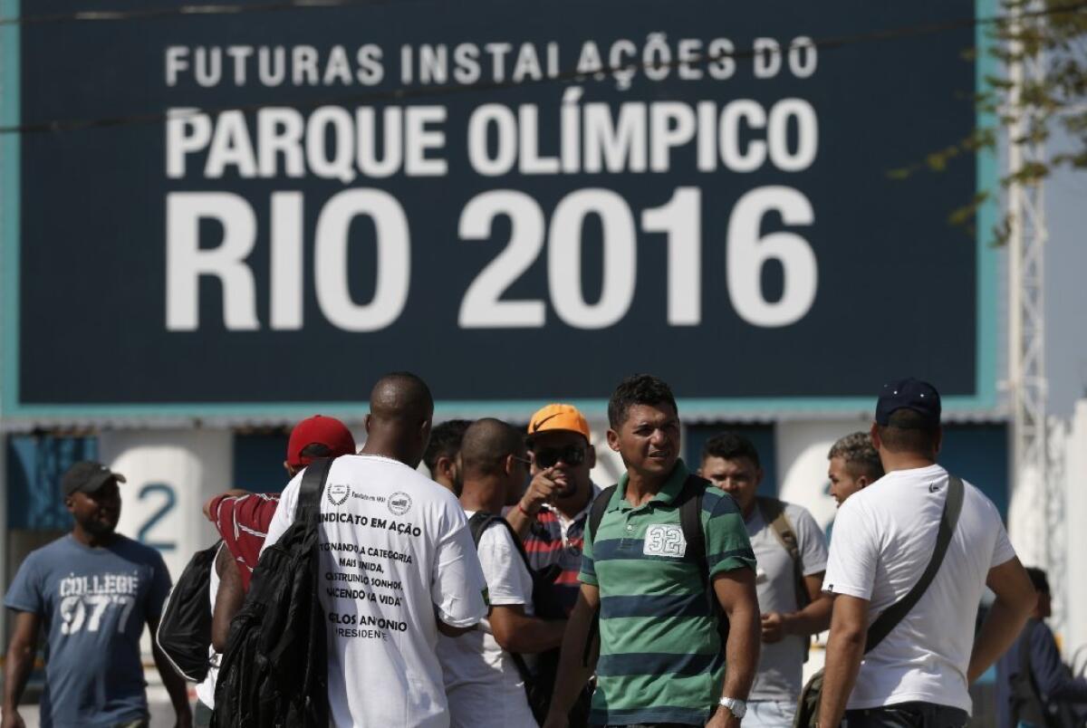 Striking workers stand in front the entrance of Olympic Park in Rio de Janeiro earlier this week.