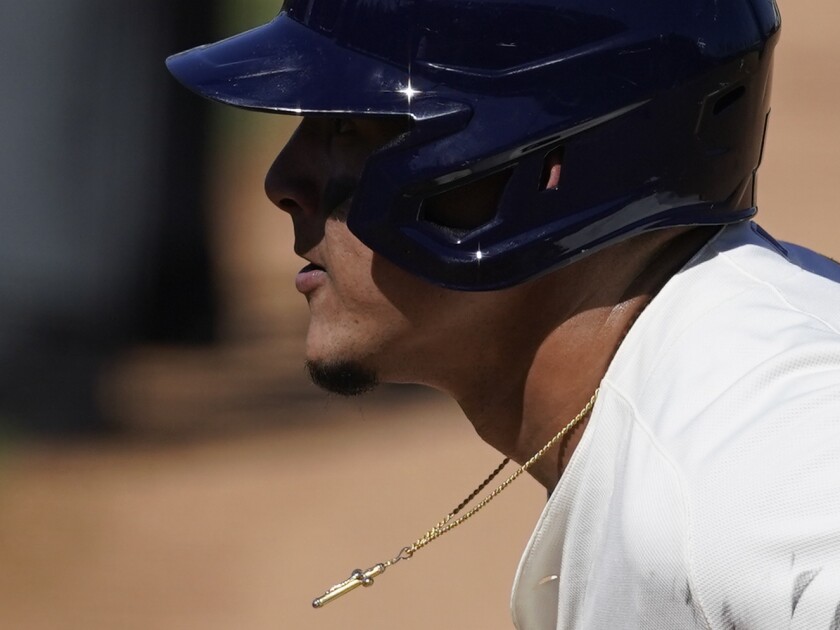 Milwaukee Brewers' Avisail Garcia leads off from first base during the fourth inning of a spring training baseball game against the Chicago Cubs Saturday, March 6, 2021, in Phoenix. (AP Photo/Ashley Landis)