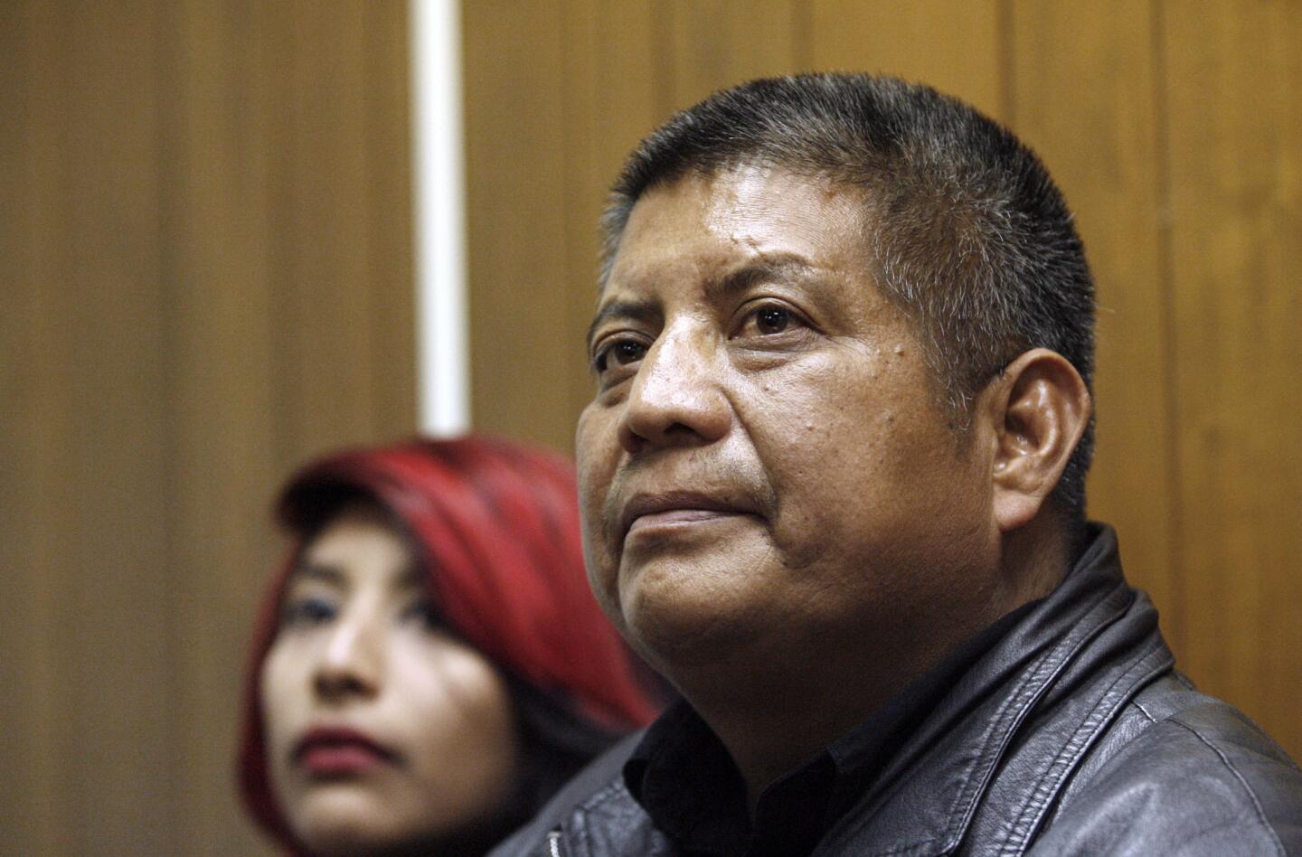 With his 16-yr. old daughter Elizabeth next to him, Francisco Cortez, 43 of Pasadena, listens to a question from a member of the media during press conference at the offices of Coalition for Humane Immigrant Rights of Los Angeles in Los Angeles on Wednesday evening, December 7, 2011. The electrician/handyman was returned to the USA today on humanitarian parole after he was deported November 15 to his native Mexico. Cortez had not complied with a deportation order issued in 1998. Cortez is undergoing treatment for kidney failure.