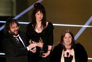 Best Adapted Screenplay-left to right-Peter Jackson, Fran Walsh and Philippa Boyens.