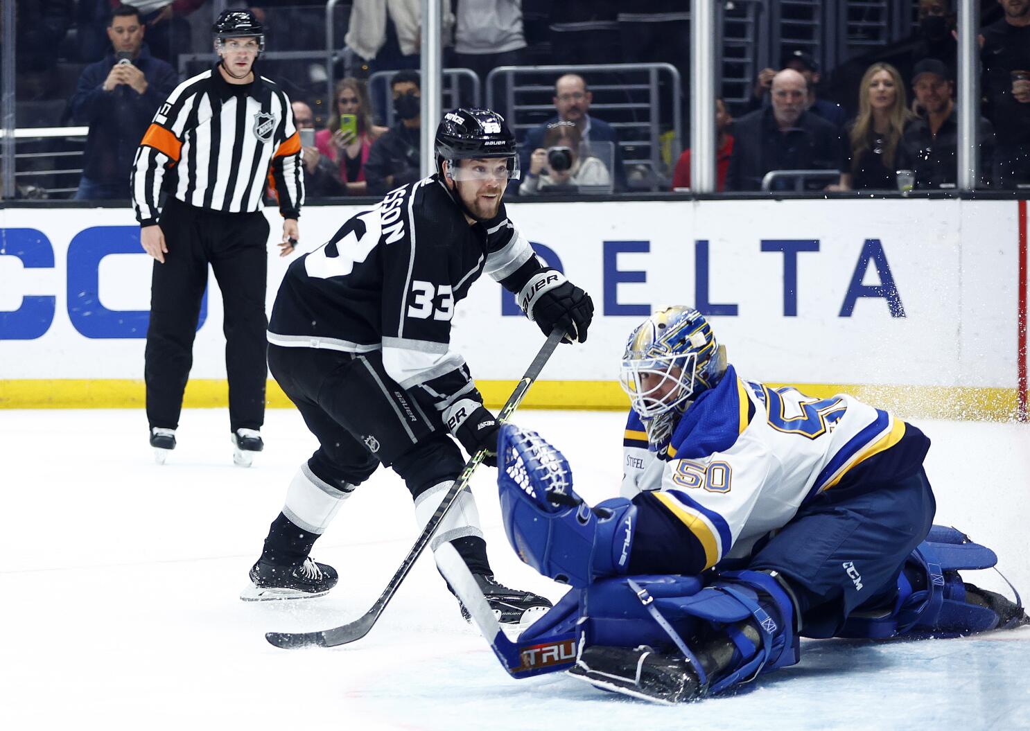 Joel Hofer of the St. Louis Blues deflects the puck with his mask News  Photo - Getty Images