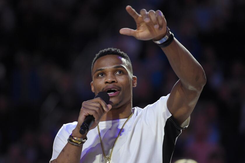 Thunder All-Star guard Russell Westbrook addreses the Pauley Pavilion crowd Thursday during a ceremony to honor the former UCLA basketball standout.