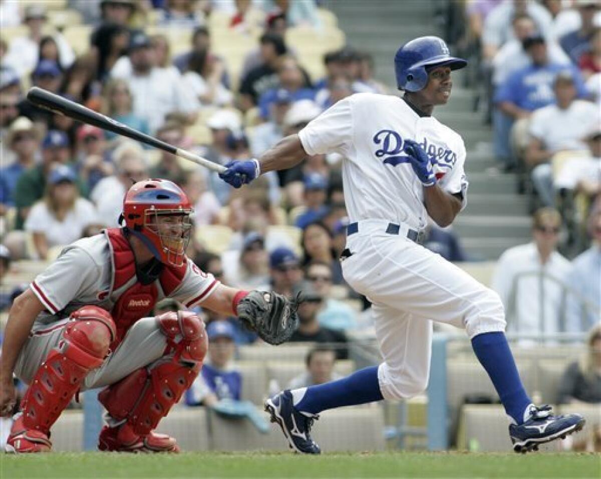 Los Angeles Dodgers' Juan Pierre, left, safely steals second base