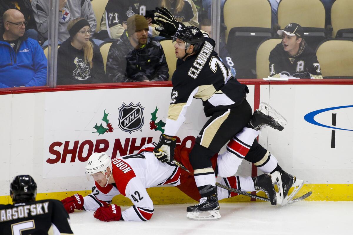 Penguins defenseman Adam Clendening (2) collides with Hurricanes left wing Joakim Nordstrom during a game earlier this season.