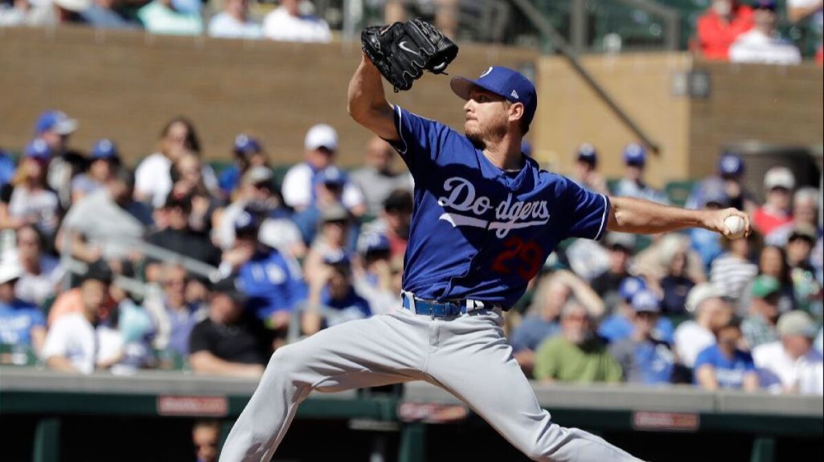 Dodgers left-hander Scott Kazmir pitches in the first inning of a game against the Rockies in spring training on March 6.
