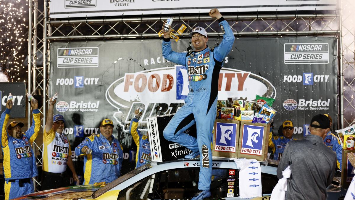 Driver Kyle Busch celebrates after winning a NASCAR Cup Series auto race.