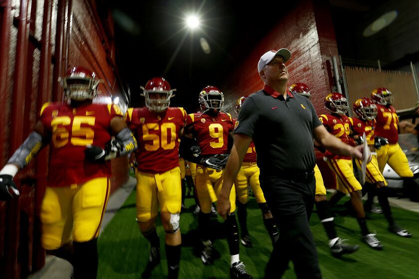 LOS ANGELES, CALIF. - OCT. 19, 2019. USC head coach Clay Helton leads his Trojans football squad down the players tunnel before the game against Oregon at the Coliseum on Saturday night, Nov,. 2, 2019. (Luis Sinco/Los Angeles Times)