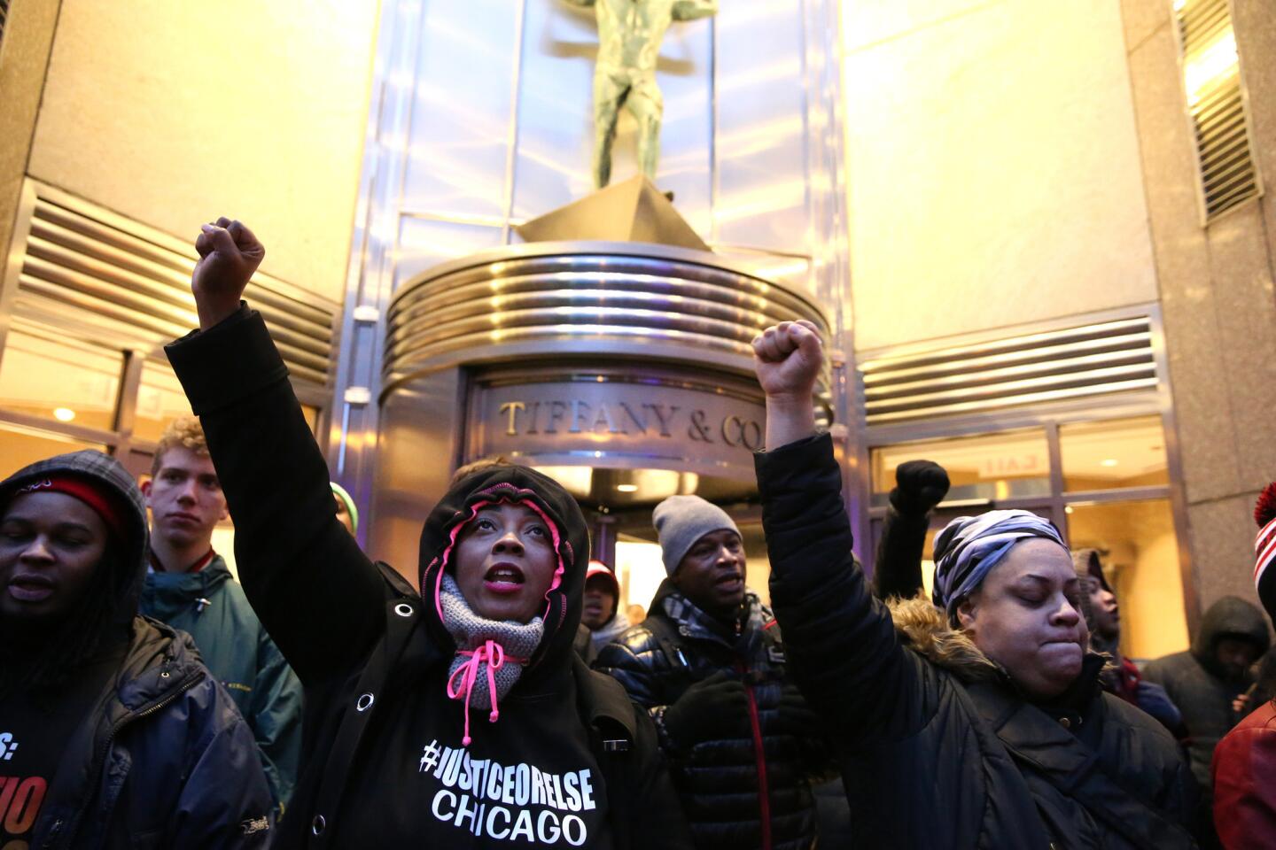 People protesting the shooting death of Laquan McDonald by a police officer block the entrance to Tiffany & Co. on the Magnificent Mile on Black Friday, Nov. 27, 2015.