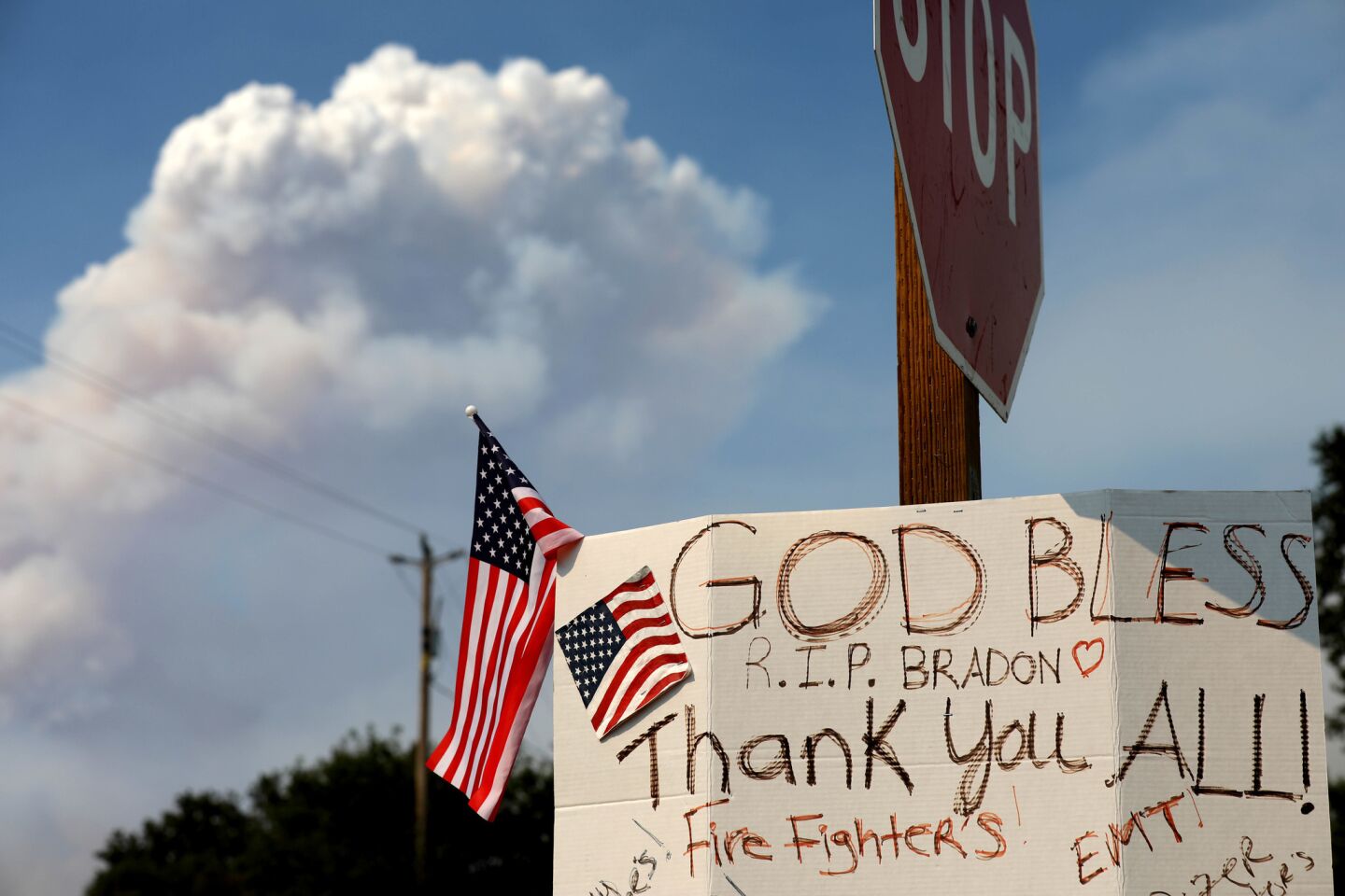 A sign hangs in remembrance of fallen dozer operator Braden Varney of Cal Fire, who died in July and for all firefighters currently protecting the park.