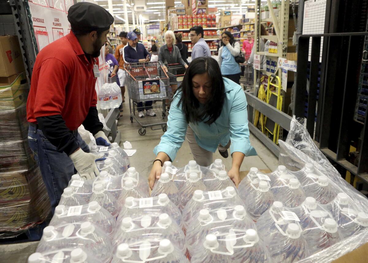 Free bottled water is prepared for distribution after Corpus Christi, Texas, residents were warned not to use tap water that might be tainted with chemicals.