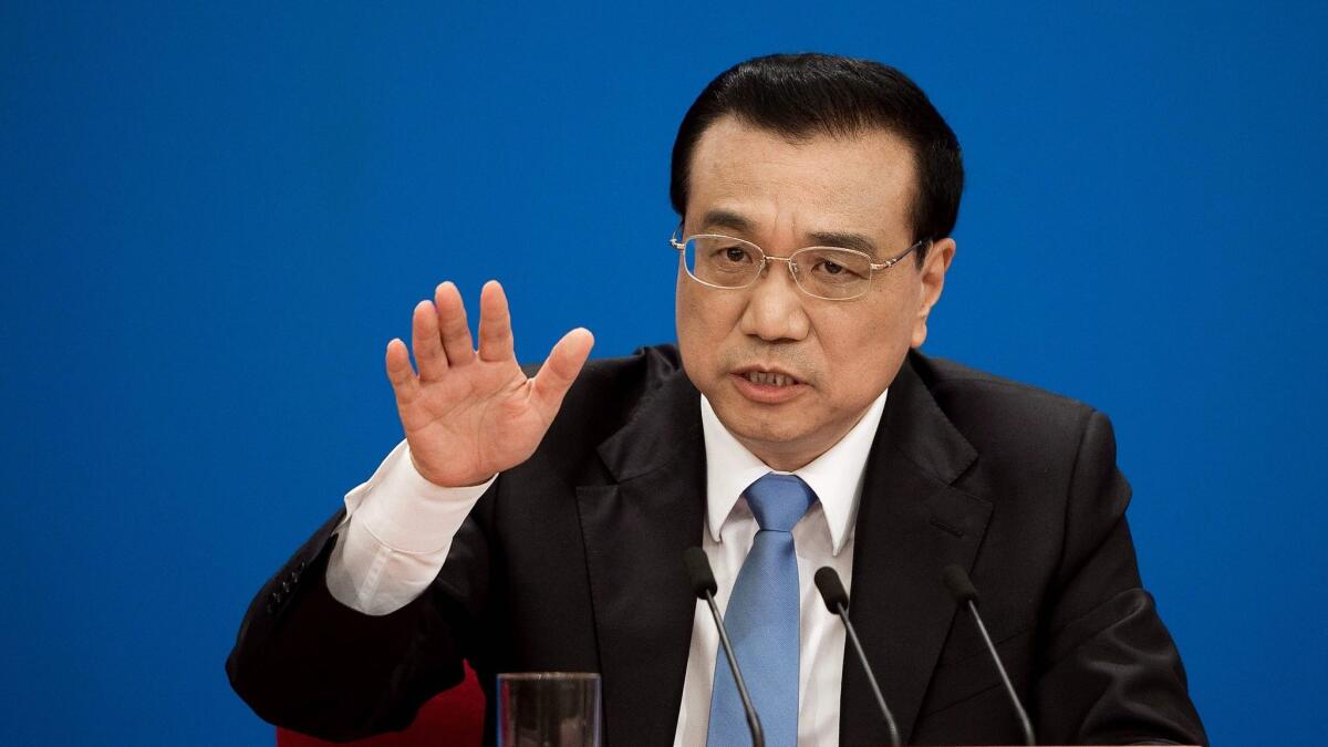 China's premier Li Keqiang speaks during a press conference after the closing ceremony of the annual session of the National People's Congress in Beijing on March 15, 2017.