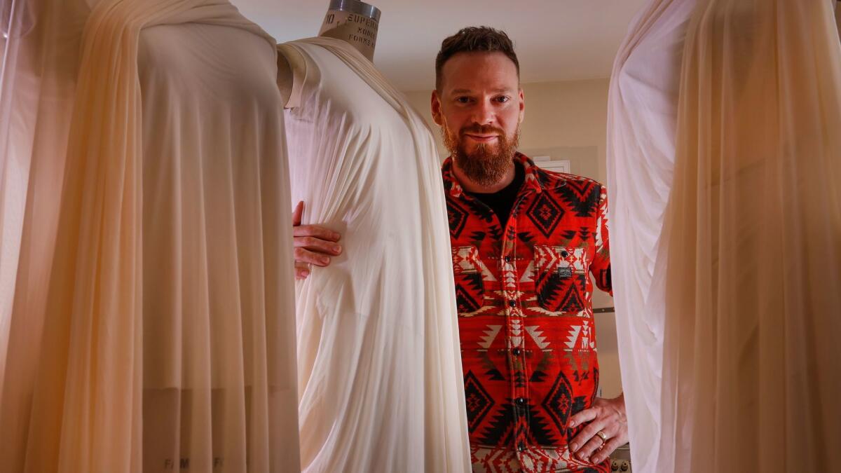 Bradon McDonald stands among dress forms for ongoing projects in his Los Angeles home studio. His work for Jessica Lang Dance can be seen Friday through Sunday at the Music Center.