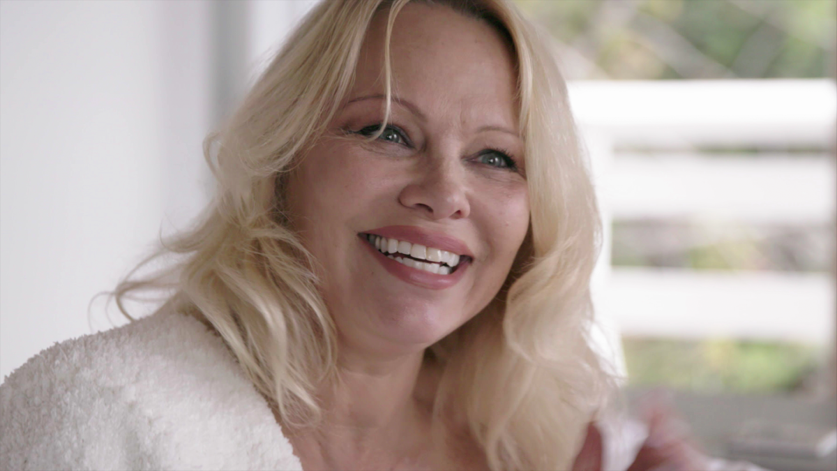 A smiling blond woman in "Pamela, a Love Story."