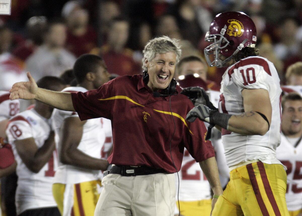Then-USC Coach Pete Carroll and Brian Cushing celebrate toward the end of the Trojans' 32-18 victory over Michigan in the Jan. 1, 2007 Rose Bowl.