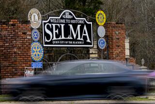 A vehicle passes by the town welcome sign, Thursday, Feb. 29, 2024, in Selma, Ala. Events commemorating the 59th anniversary of the Bloody Sunday voting rights march in 1965 will culminate with a bridge crossing in Selma, Ala, on Sunday, March 3. (AP Photo/Mike Stewart)