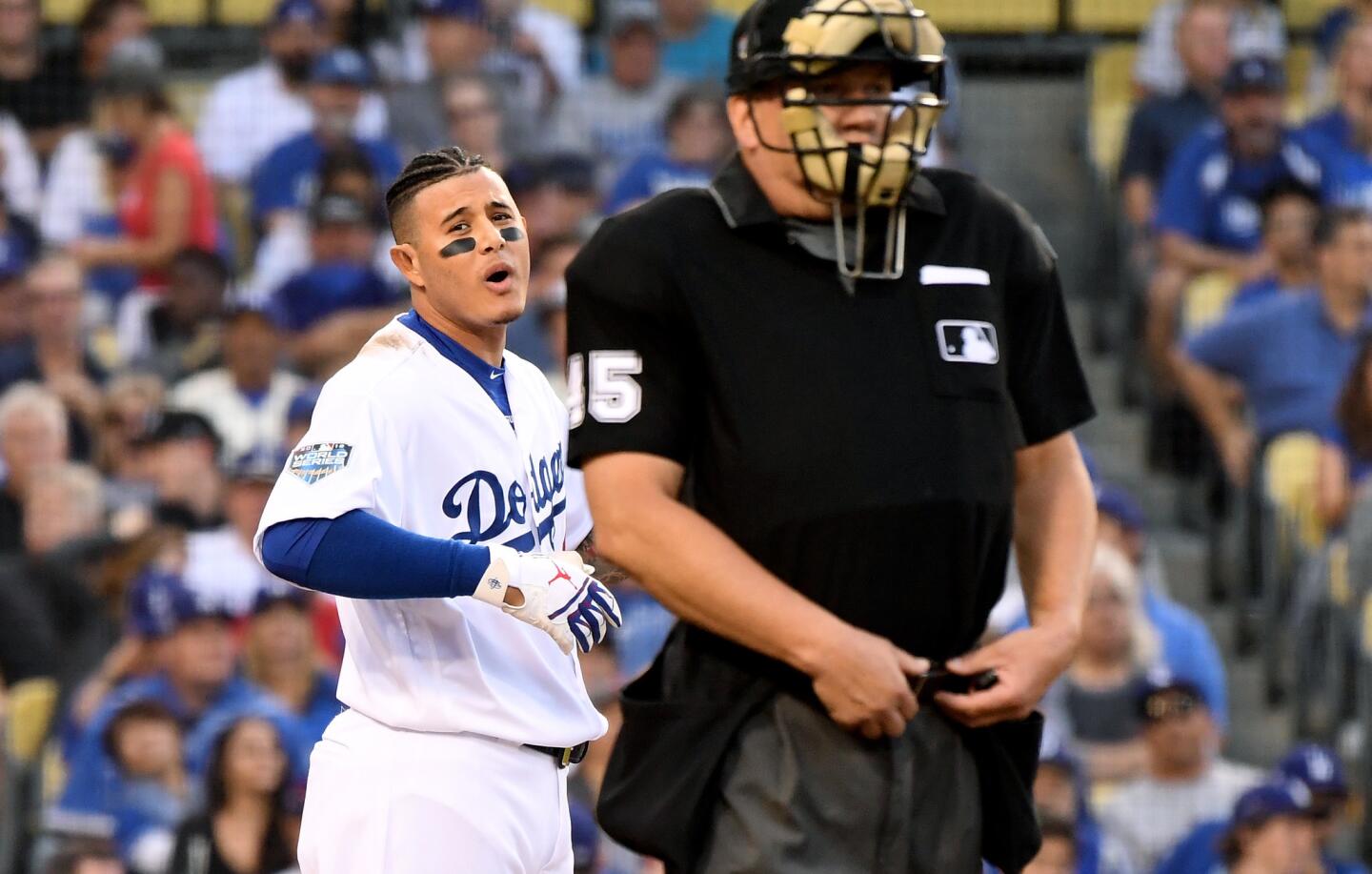 Ddogers Manny Machado complains to home plate umpire Jeff Nelson afgter striking out against the Red Sox in the 1st inning.