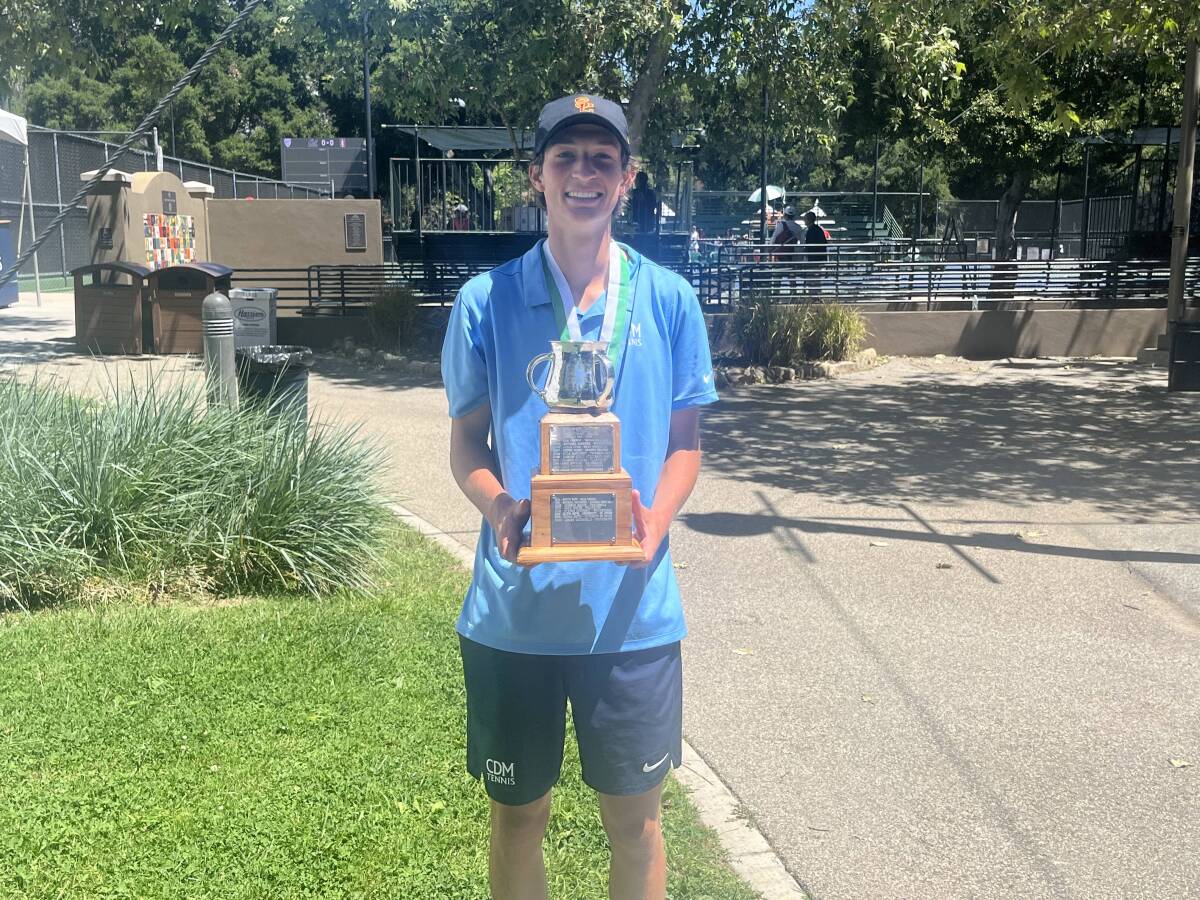 CdM boys' tennis senior Niels Hoffmann with the Farnam Cup perpetual trophy after winning the Ojai Tournament title.