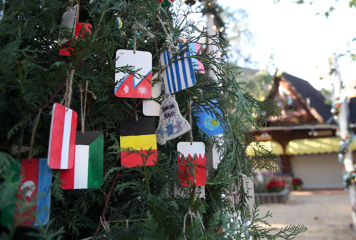 The El Morro Elementary "We are the World" Christmas tree stands tall in Santa's Village at the Sawdust Art Festival.