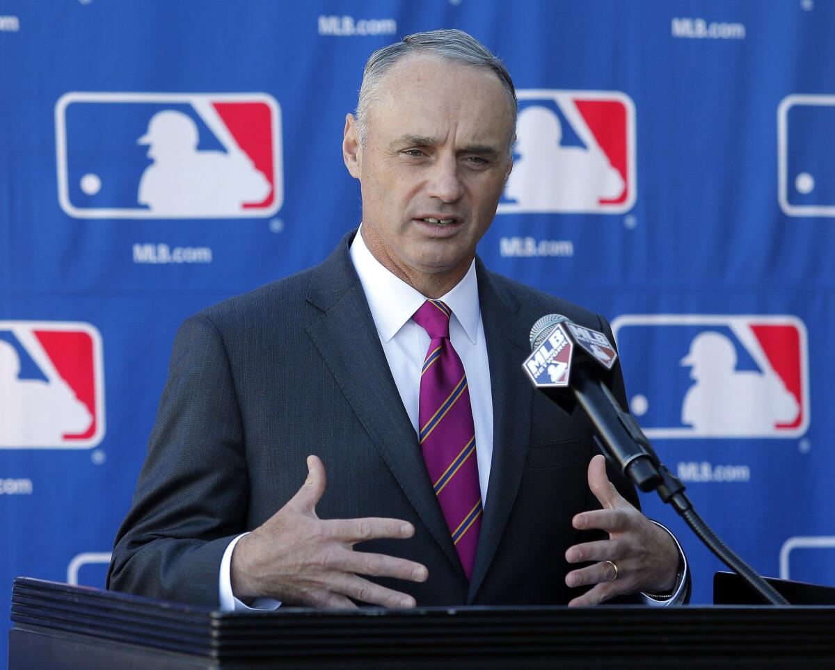 Rob Manfred, then MLB's commissioner-elect, speaks during a news conference at the owners meeting in Phoenix on Jan. 15.