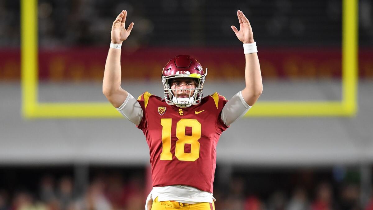 USC quarterback JT Daniels signals touchdown on a catch during a game in September 2018.