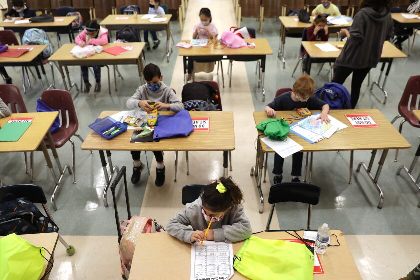 LOS ANGELES-CA-APRIL 16, 2021: First graders do schoolwork in the auditorium during opening week at Warner Avenue Elementary School in Westwood on Friday, April 16, 2021. (Christina House / Los Angeles Times)