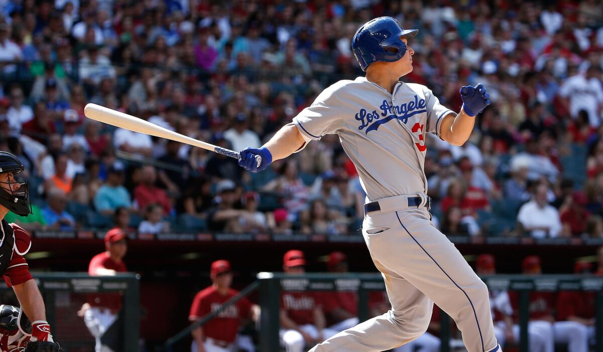 Dodgers center fielder Joc Pederson watches his solo home run against the Diamondbacks in the sixth inning on April 12 at Chase Field.