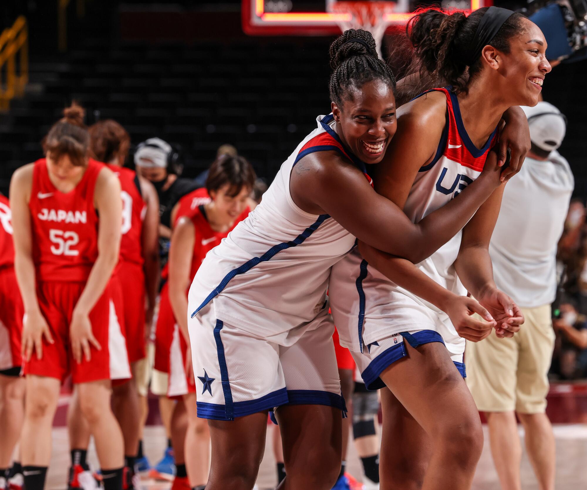 USA's A'Ja Wilson (9) and Chelsea Gray celebrate.