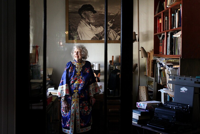 Carla Laemmle at her home in Los Angeles in 2012; above her is a photograph of longtime boyfriend and director Ray Cannon.