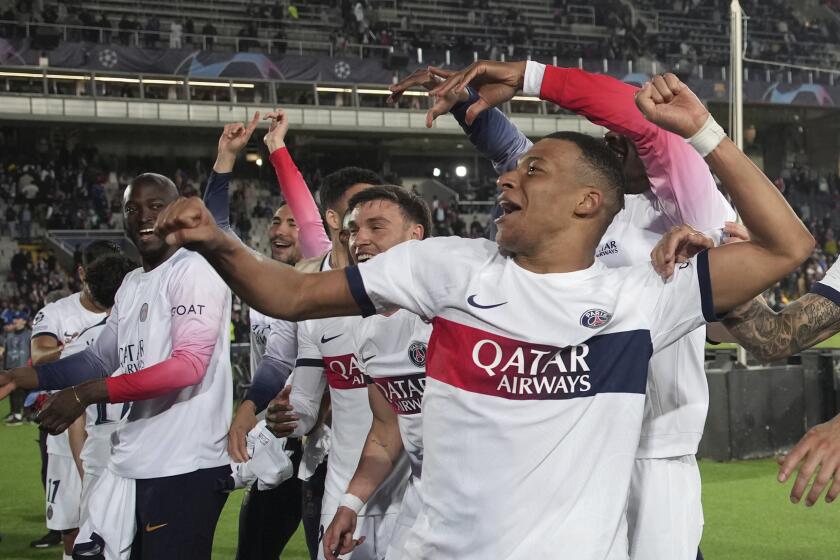 PSG's Kylian Mbappe celebrates at the end of the Champions League quarterfinal second leg soccer match between Barcelona and Paris Saint-Germain at the Olimpic Lluis Companys stadium in Barcelona, Spain, Tuesday, April 16, 2024. (AP Photo/Emilio Morenatti)