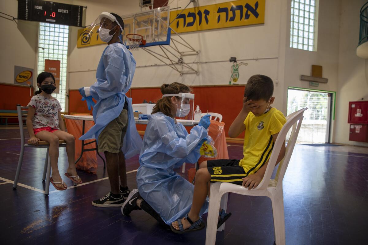 Children being tested for the coronavirus in Israel