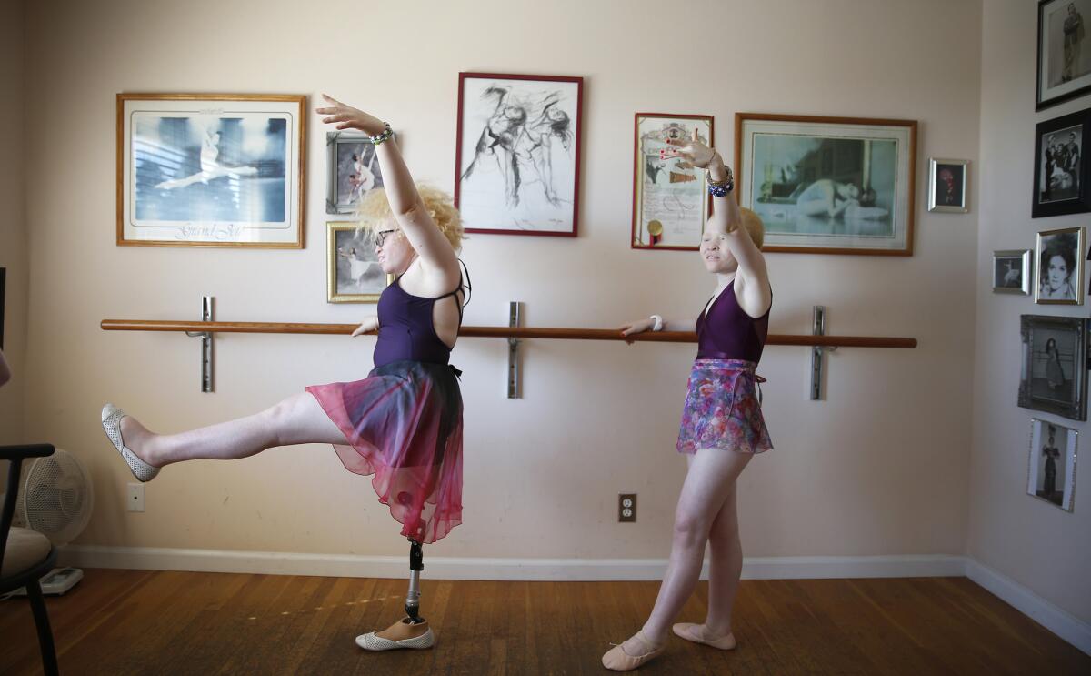 Bibiana Mashamba, left, and her younger sister Tindi take a ballet lesson in Rancho Palos Verdes.