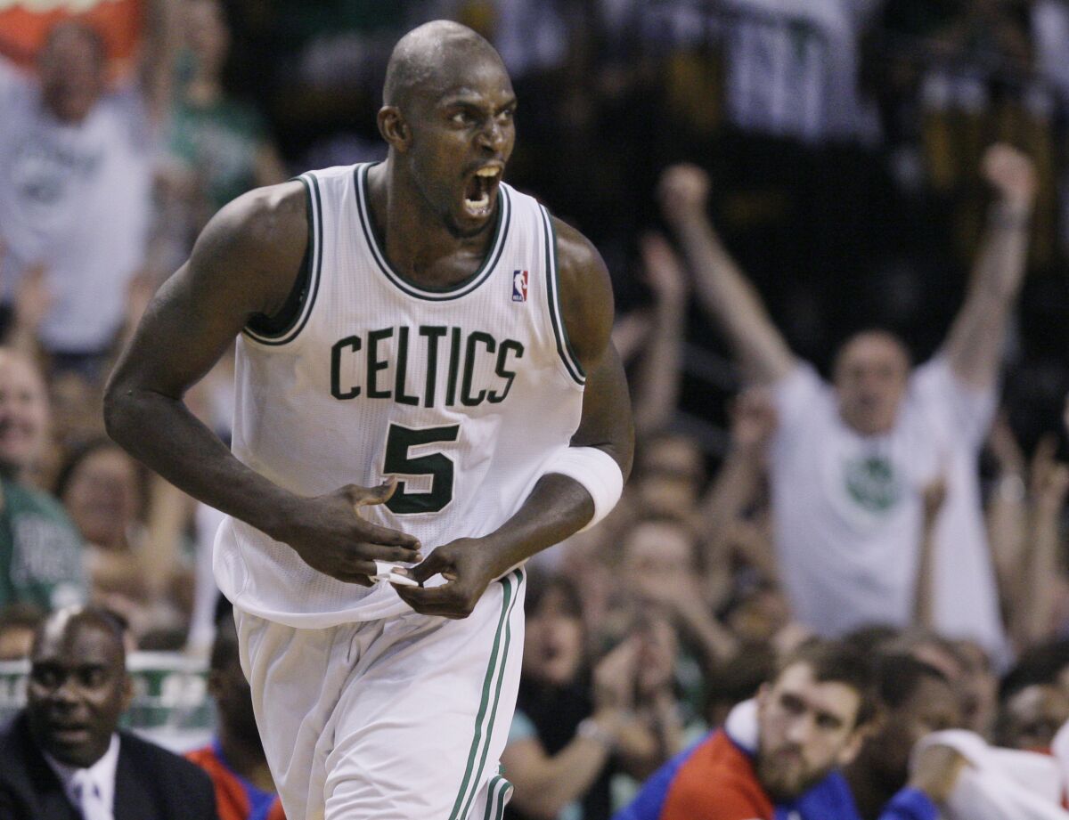 FILE -Boston Celtics forward Kevin Garnett screams after he scored during the fourth quarter of Game 7 against the Philadelphia 76ers in an NBA basketball Eastern Conference semifinal playoff series, Saturday, May 26, 2012, in Boston. KG is set to add another chapter to his legacy when he becomes the 24th member of the Celtics organization to have his jersey number retired. (AP Photo/Elise Amendola, File)