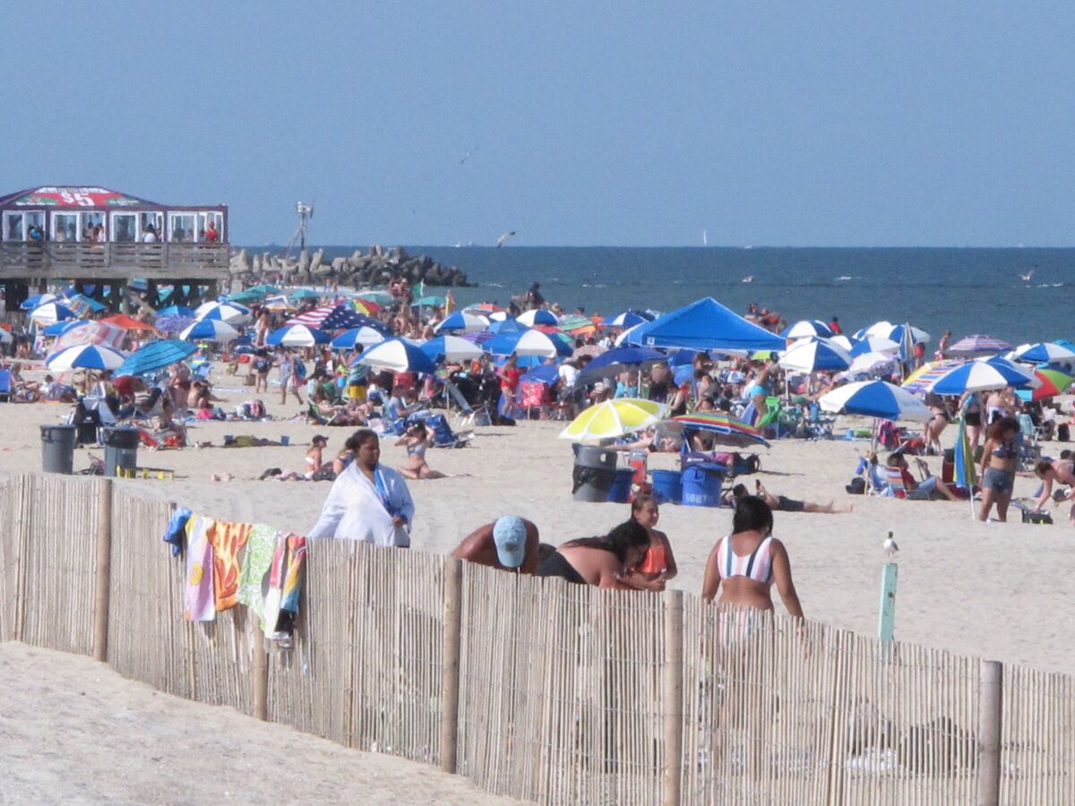 Beachgoers enjoy a sunny day on the beach in Point Pleasant Beach, N.J., on July 15, 2019. Point Pleasant Beach's mayor said on June 10, 2022, that it would join Long Branch, N.J., in seeking court orders to prevent so-called "pop-up parties" on its beachfront without prior approval by the local government. (AP Photo/Wayne Parry)