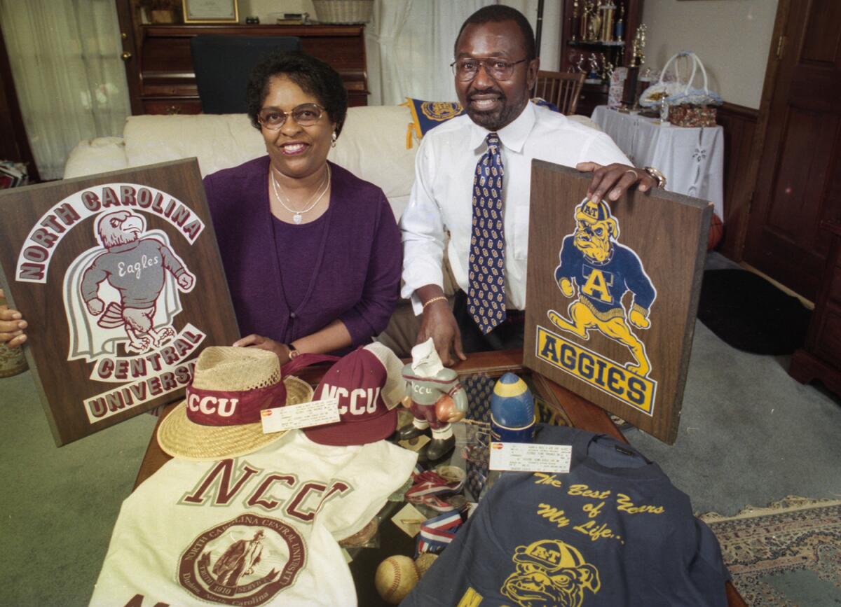 Virginia and Matthew Jarmond pose with NCCU and Aggies paraphernalia.