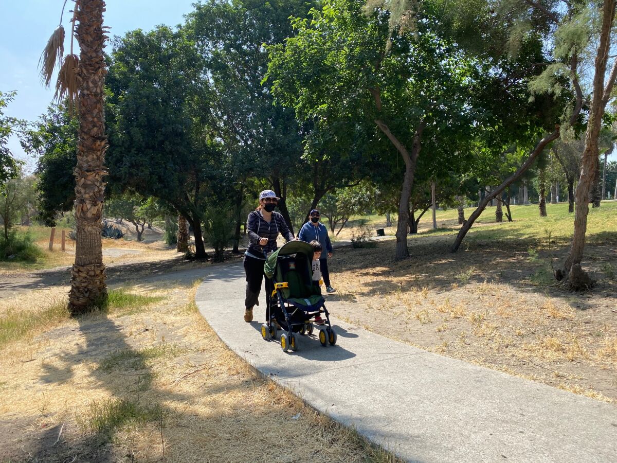 Tijuana resident Marcela Gonzalez, 44, pushes her son's stroller 