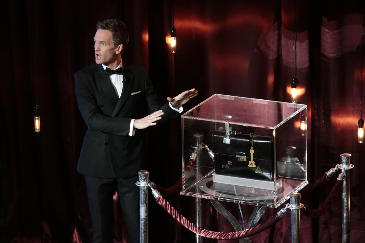 Host Neil Patrick Harris performs a magic trick during the telecast of the 87th Academy Awards on Feb. 22.