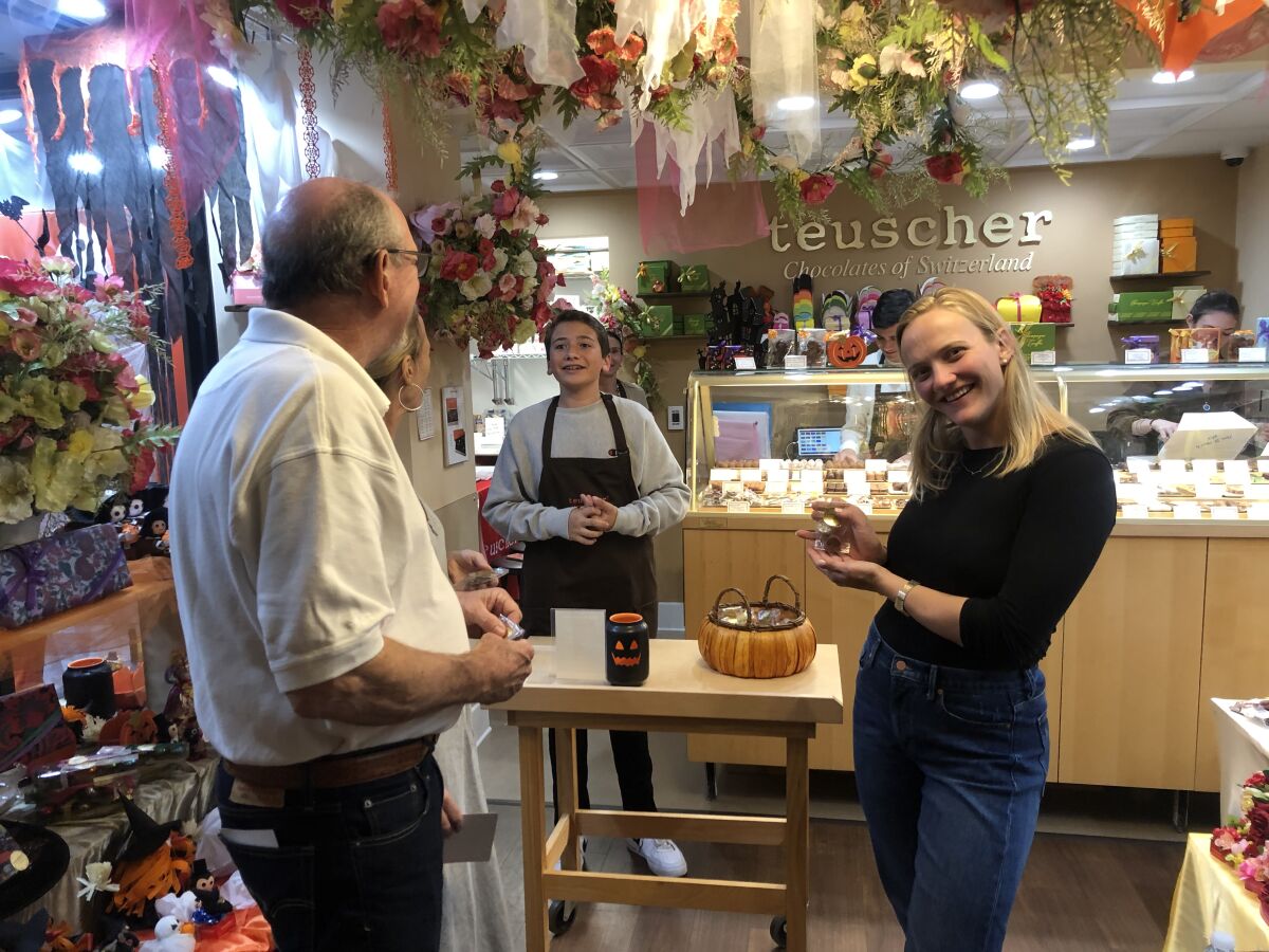 Tom, Syd and Laura Cummings visit Teuscher Chocolates San Diego as part of Taste of La Jolla in 2019. 