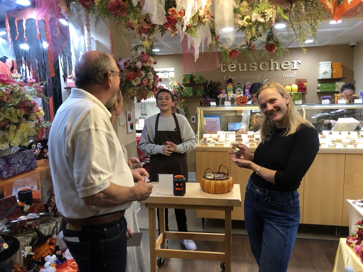 Tom, Syd and Laura Cummings visit Teuscher Chocolates San Diego as part of Taste of La Jolla in 2019.