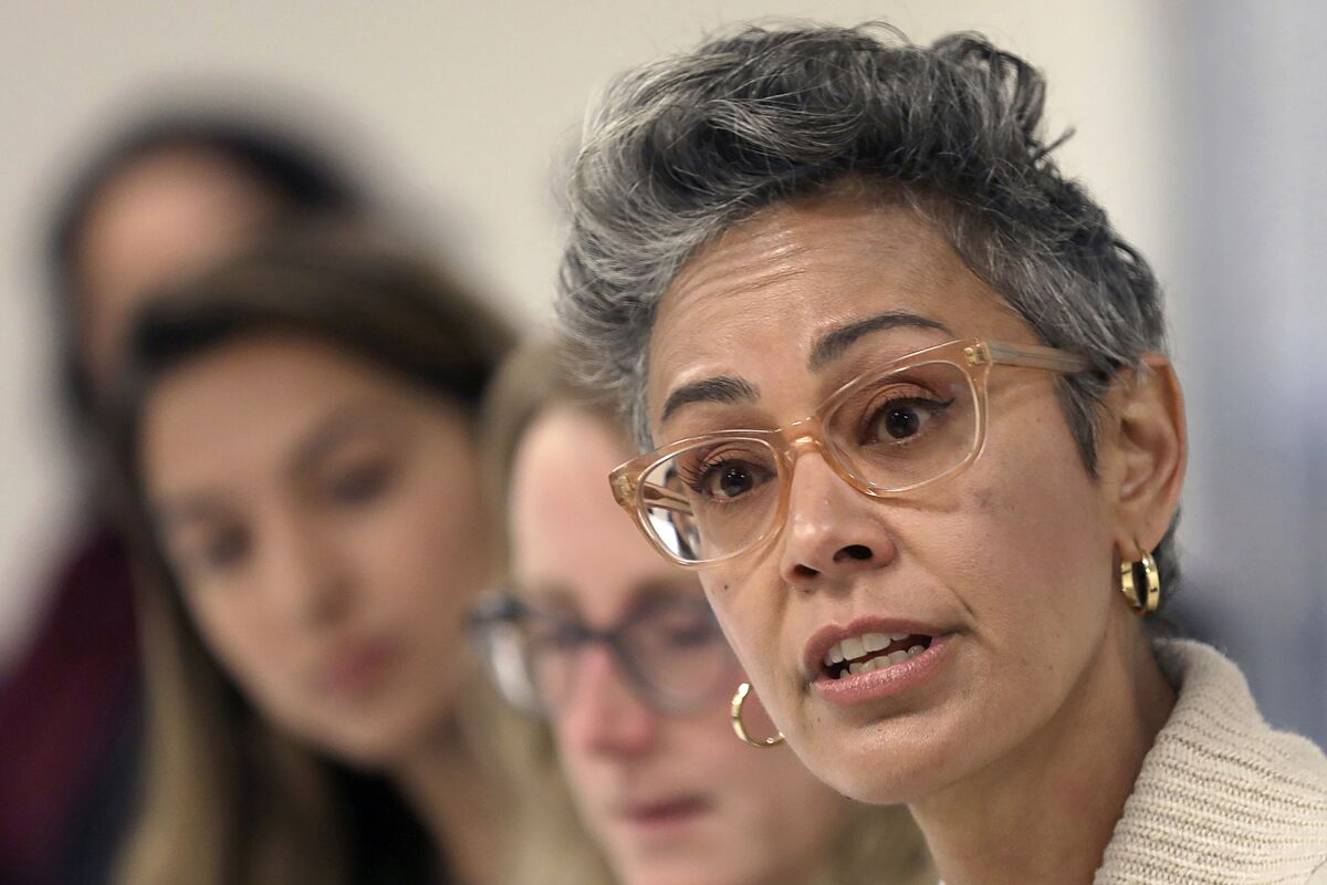 FILE - Alison Collins, right, speaks during a meeting in San Francisco, on Sept. 26, 2018. In a city with the lowest percentage of children of all major American cities, school board elections in San Francisco have often been an afterthought. A special election on Feb. 15, 2022, will decide the fate of three school board members, all Democrats, including Collins, in a vote that has divided the famously liberal city. (Liz Hafalia/San Francisco Chronicle via AP)