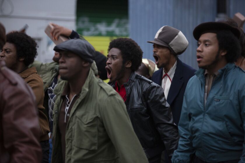 Sheyi Cole(center) as Alex Wheatle in "Alex Wheatle", part of the "Small Axe" series directed by Steve McQueen. Small Axe is based on the real-life experiences of London's West Indian community and is set between 1969 and 1982.