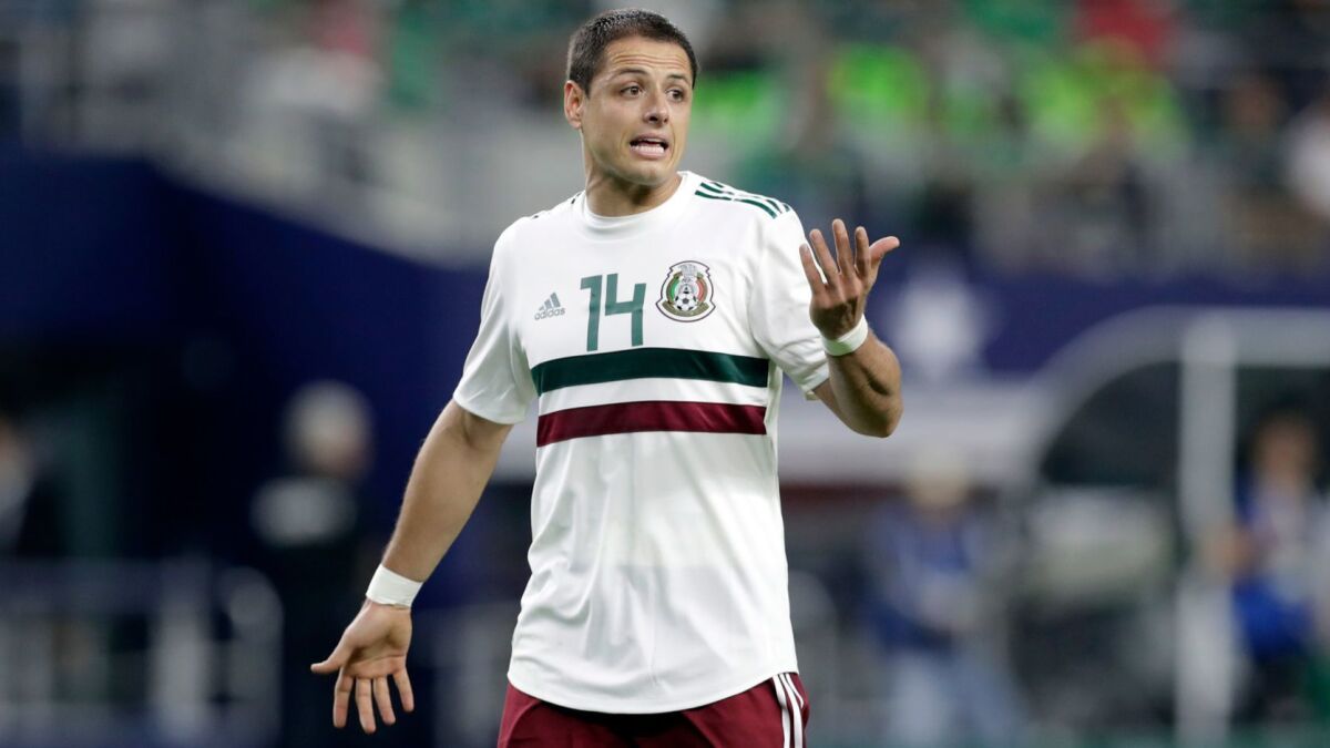 Mexico forward Javier "Chicharito" Hernandez jogs across the field talking to an official during a international friendly soccer match against Croatia in Arlington, Texas, on March 27, 2018.