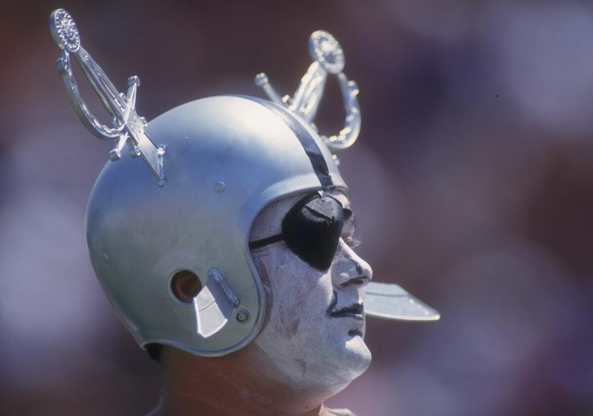 A Los Angeles Raiders fan looks on during a home game  at the Coliseum in 1993.