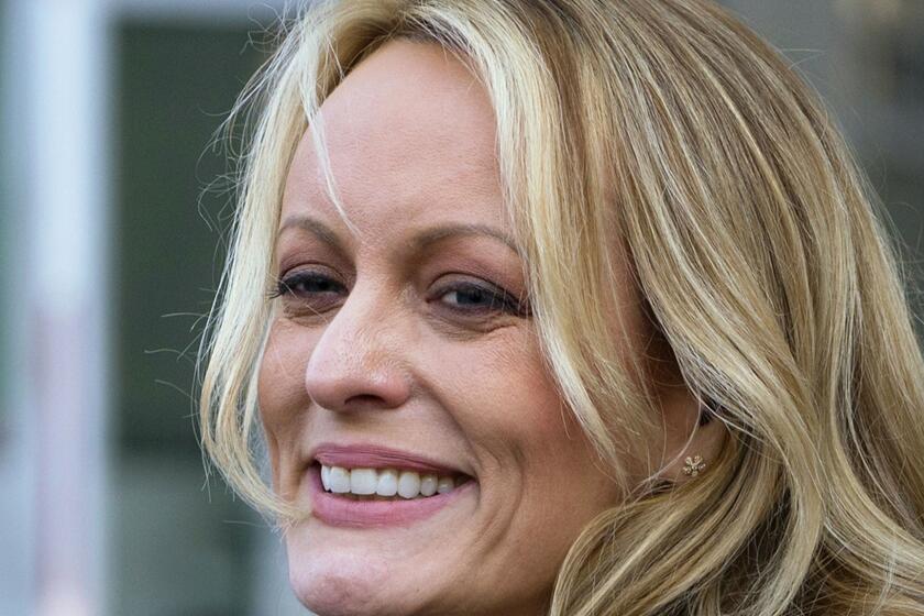 FILE - In this April 16, 2018 file photo, adult film actress Stormy Daniels speaks to members of the media after a hearing at federal court in New York. Daniels is telling her story in a new memoir titled Full Disclosure. The porn star who alleges an affair with President Donald Trump announced the book on ABCs The View Wednesday. (AP Photo/Craig Ruttle)