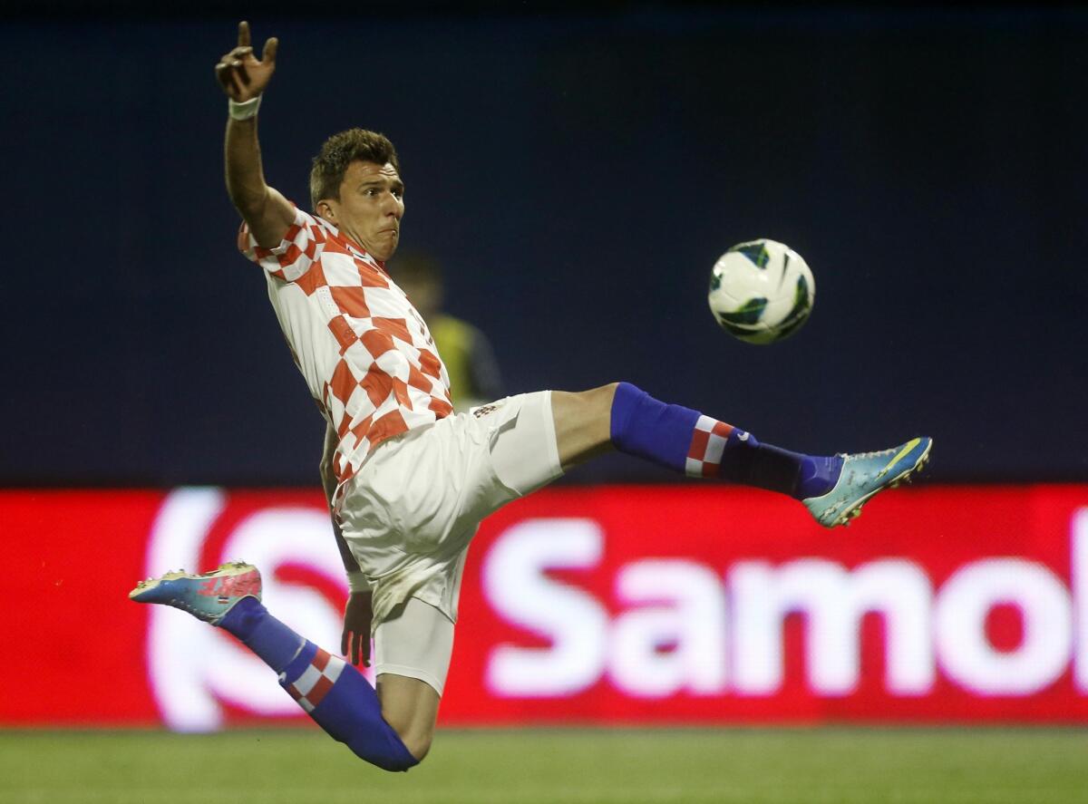 Croatian striker Mario Mandzukic must sit out Thursday's opening game again Brazil because he received a red card in the qualifying round.