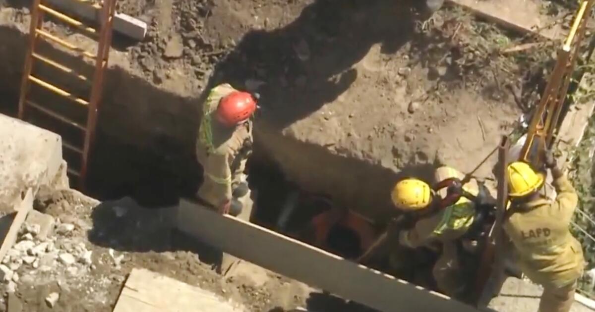 Firefighters work to rescue man buried in trench in Los Feliz