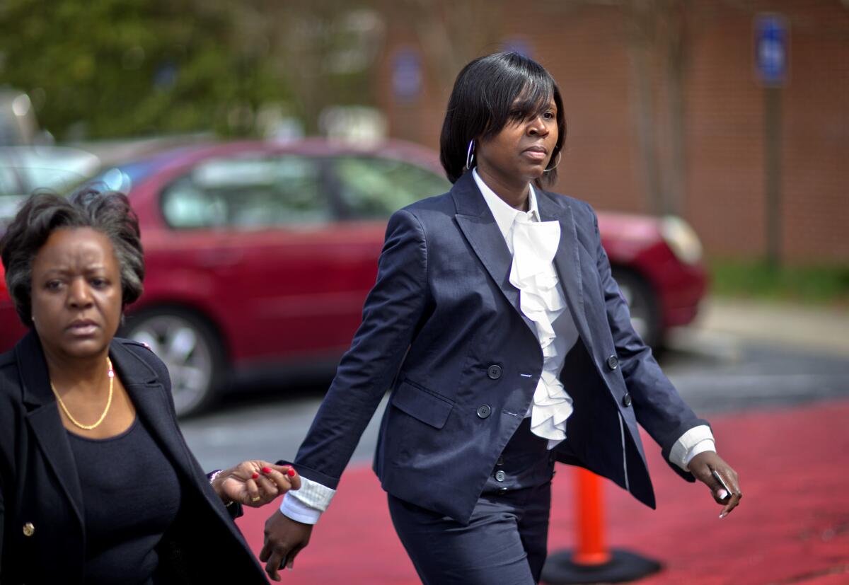 The Atlanta cheating scandal illustrates the dangers of the modern infatuation with incentives and what's called "pay for performance." Above: Atlanta Public Schools defendant Sandra Ward, right, turns herself in at the Fulton County Jail accompanied by her attorney Robbin Shipp, left, on April 2 in Atlanta.
