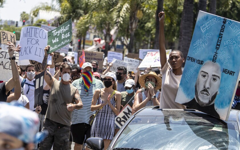 Protesters march through West Hollywood to demand justice for the killing of George Floyd on June 3.