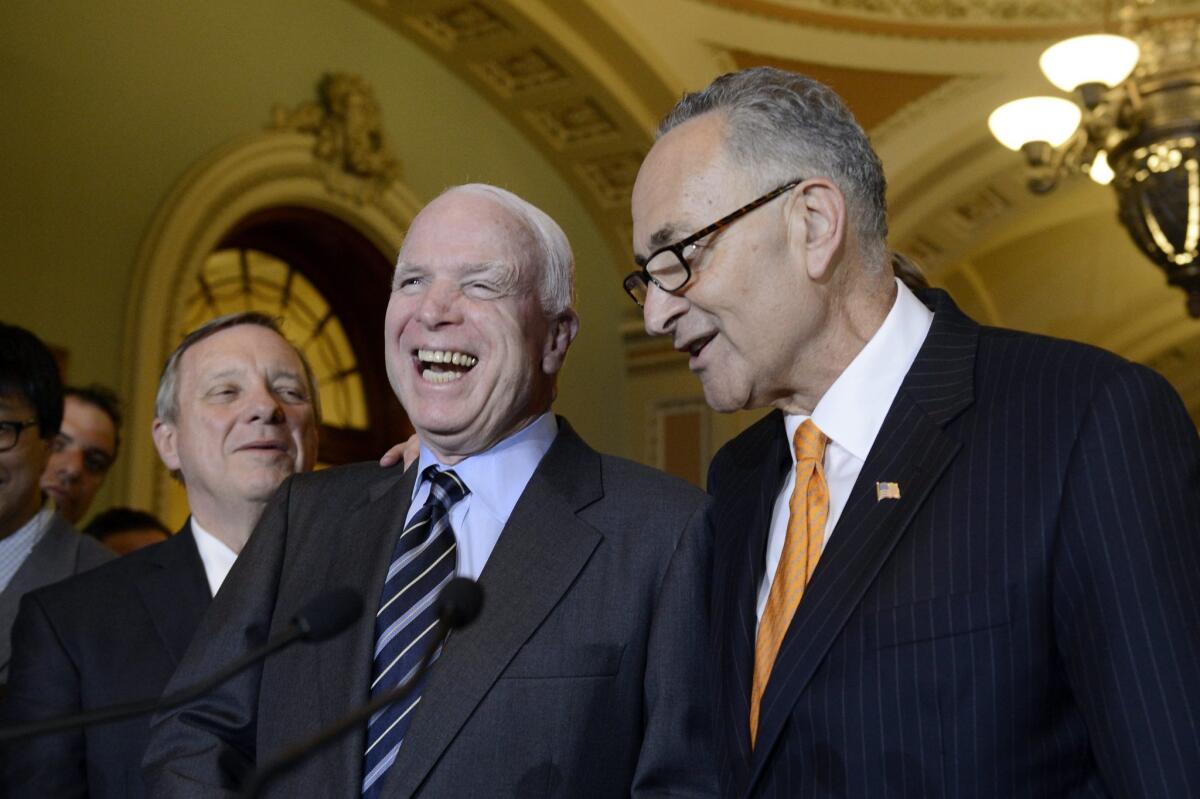 Republican Sen. John McCain, center, with Democratic Sen. Charles E. Schumer, right, and Democratic Sen. Richard J. Durbin after the Senate voted to pass comprehensive immigration reform legislation last month.
