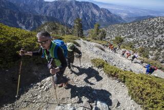 MT. BALDY, CALIF. -- SATURDAY, MAY 20, 2017: Hikers makes their way up to the summit of Mt. Baldy where the late and legendary Sam Kim was honored during a memorial hike of Mt. Baldy, symbolically completing his dream of 1000 summits in Mt. Baldy, Calif., on May 20, 2017. (Brian van der Brug / Los Angeles Times)